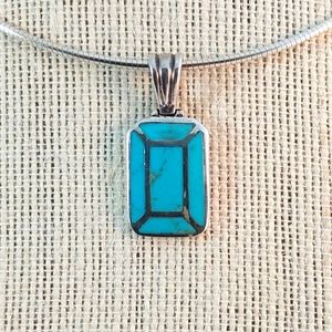 Turquoise pendant inlaid in 925 sterling silver